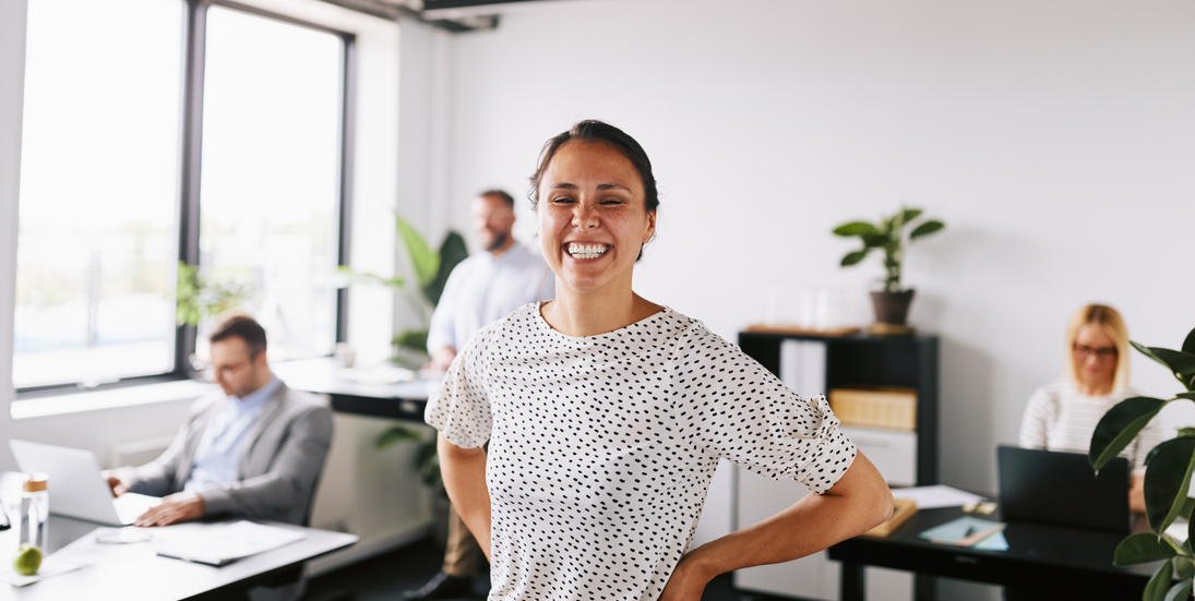 Young Businesswoman Laughing at Work